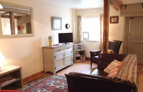 Living Room with Oak Beams inside Self Catering Family Farm Cottage Shropshire